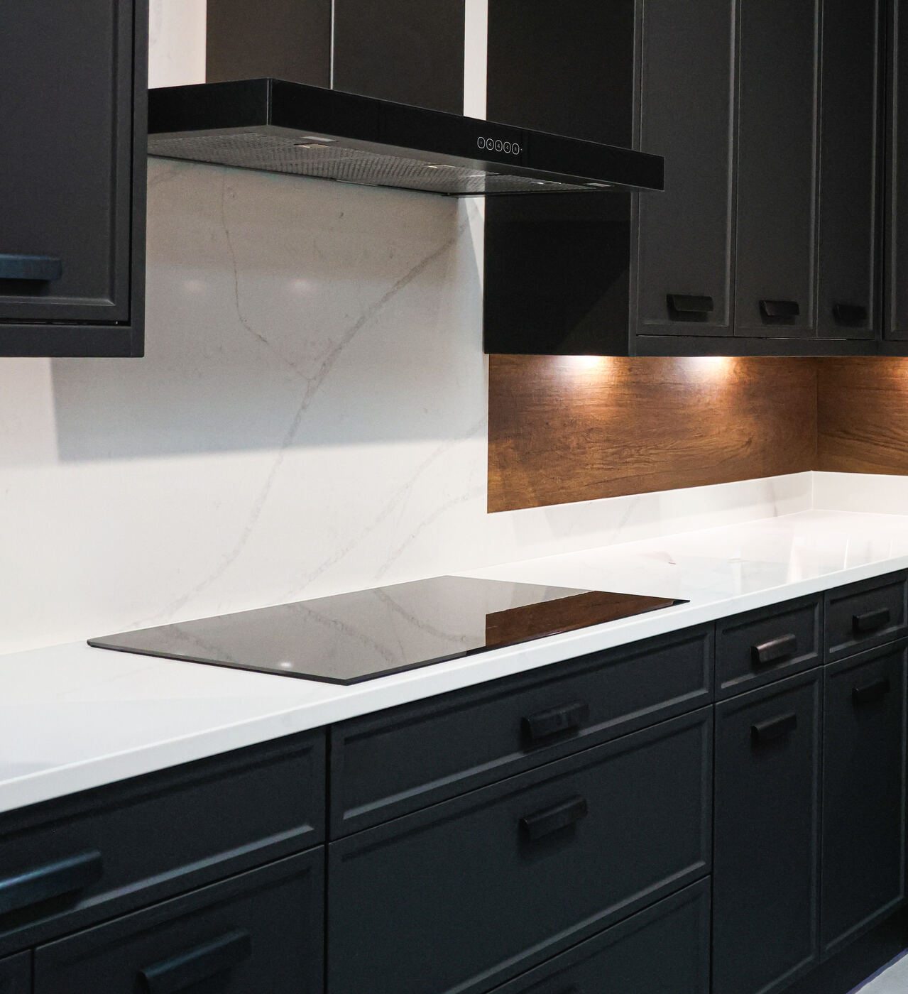 Custom dark cabinetry with marble countertop
